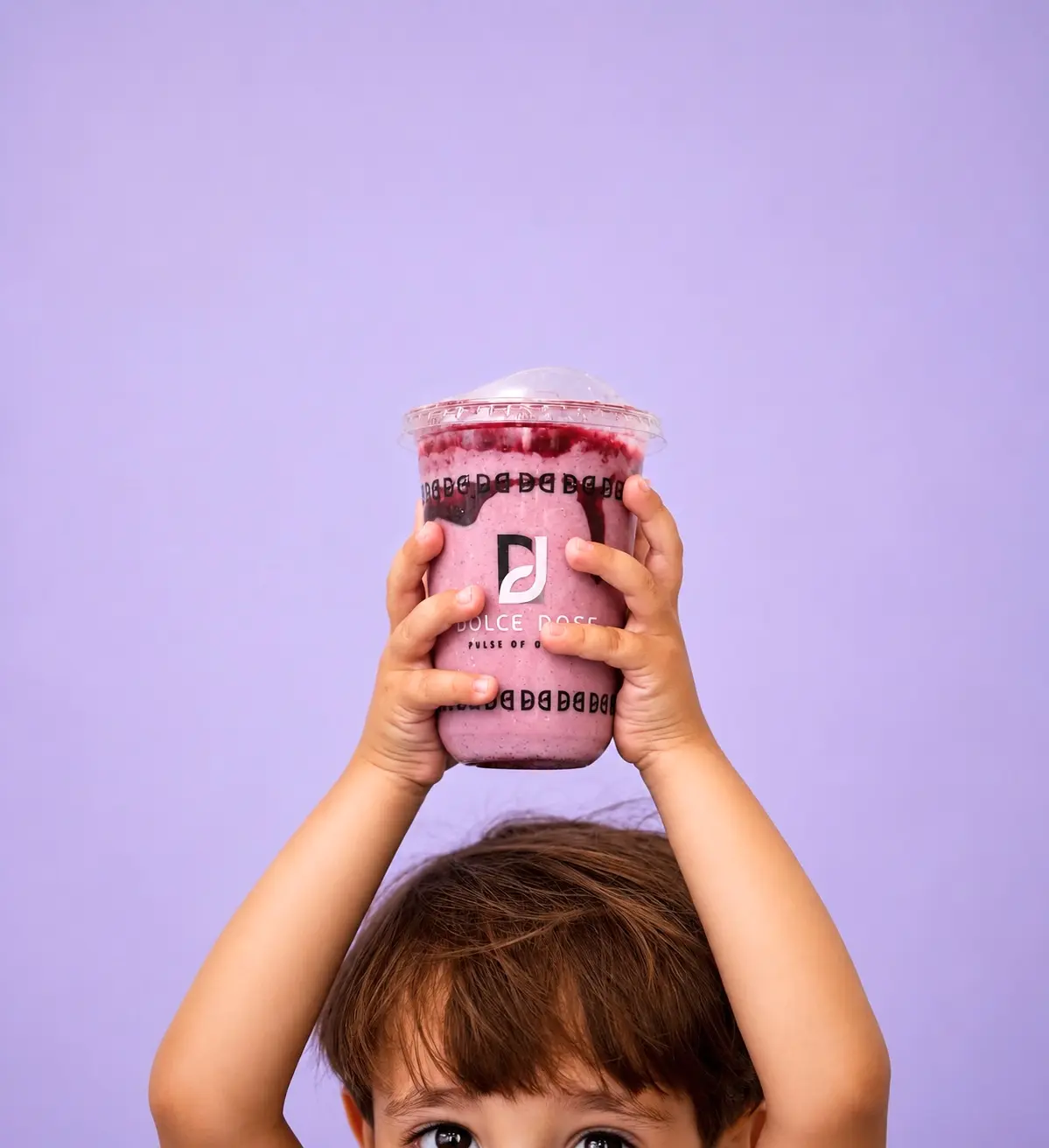 Child holding a purple Dolce Dose drink