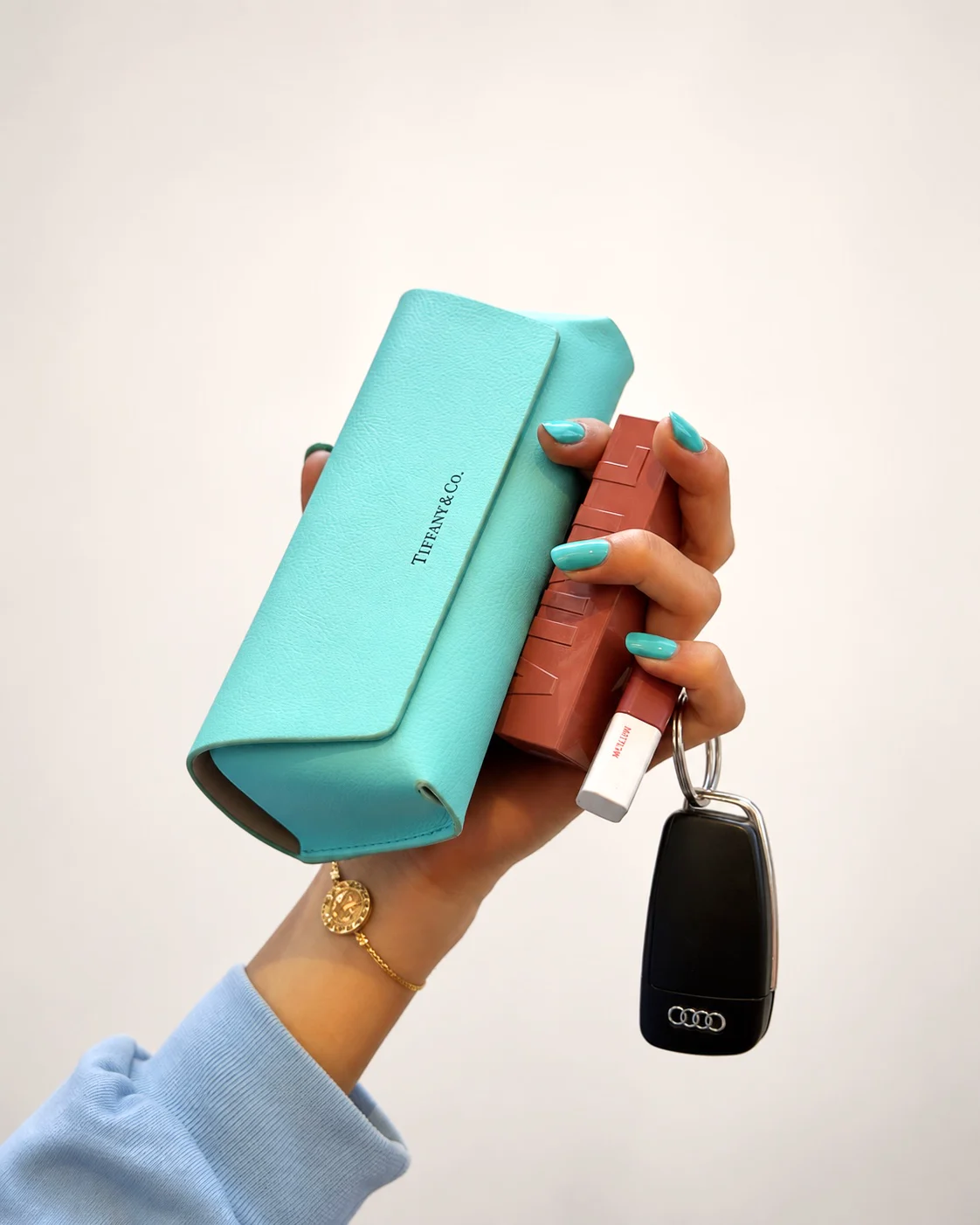 Turquoise Kanyo manicure styled with fashion accessories